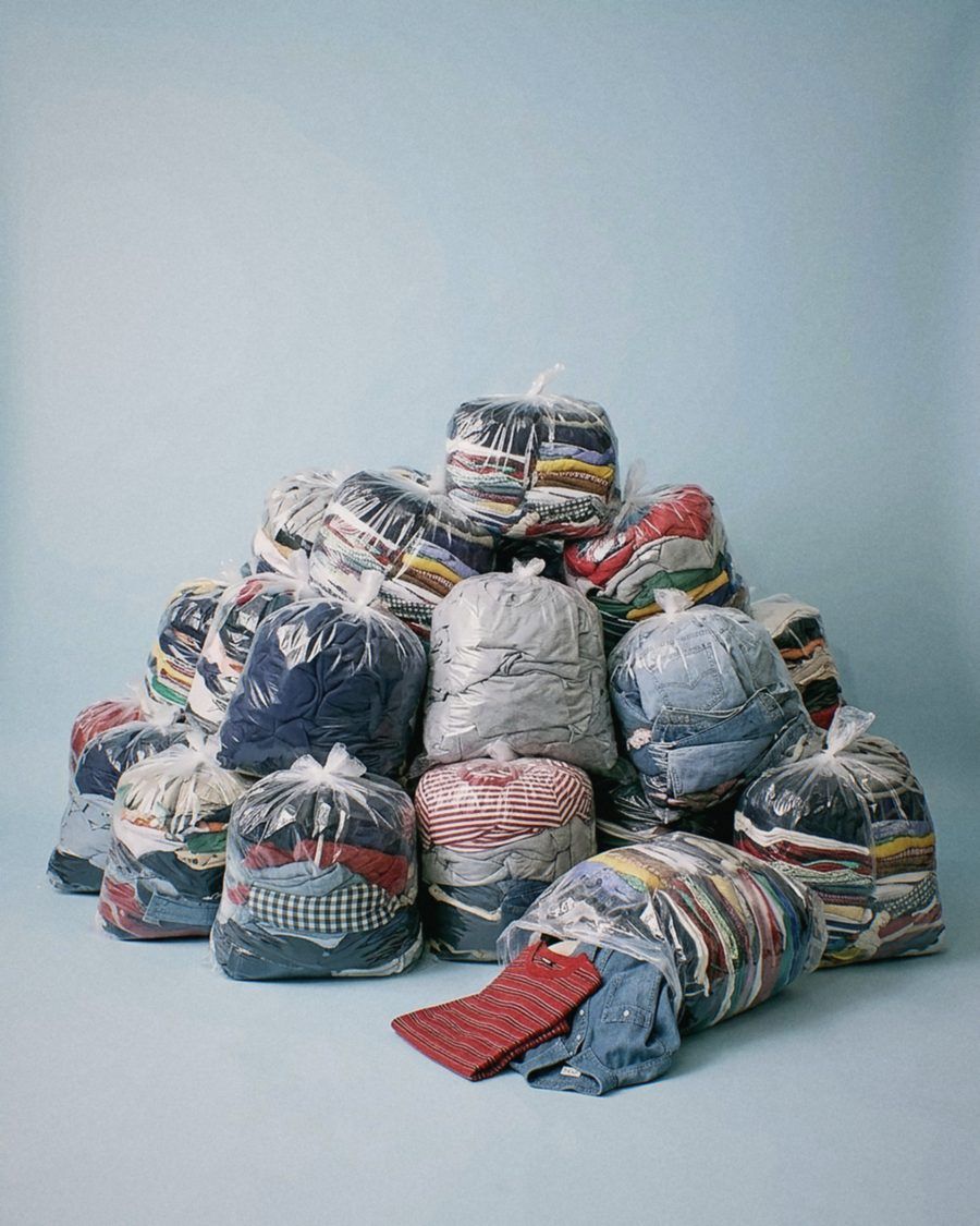 A pile of bagged clothes from a factory delivery